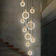 Lysekrone med LED-ringer i piletre og akryl for trapperom