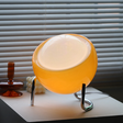Retro bordlampe med oransje glasskule på bøyd krombein, Oransje og krom