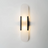 Vegglampe i marmor med oval form og metallramme, Svart